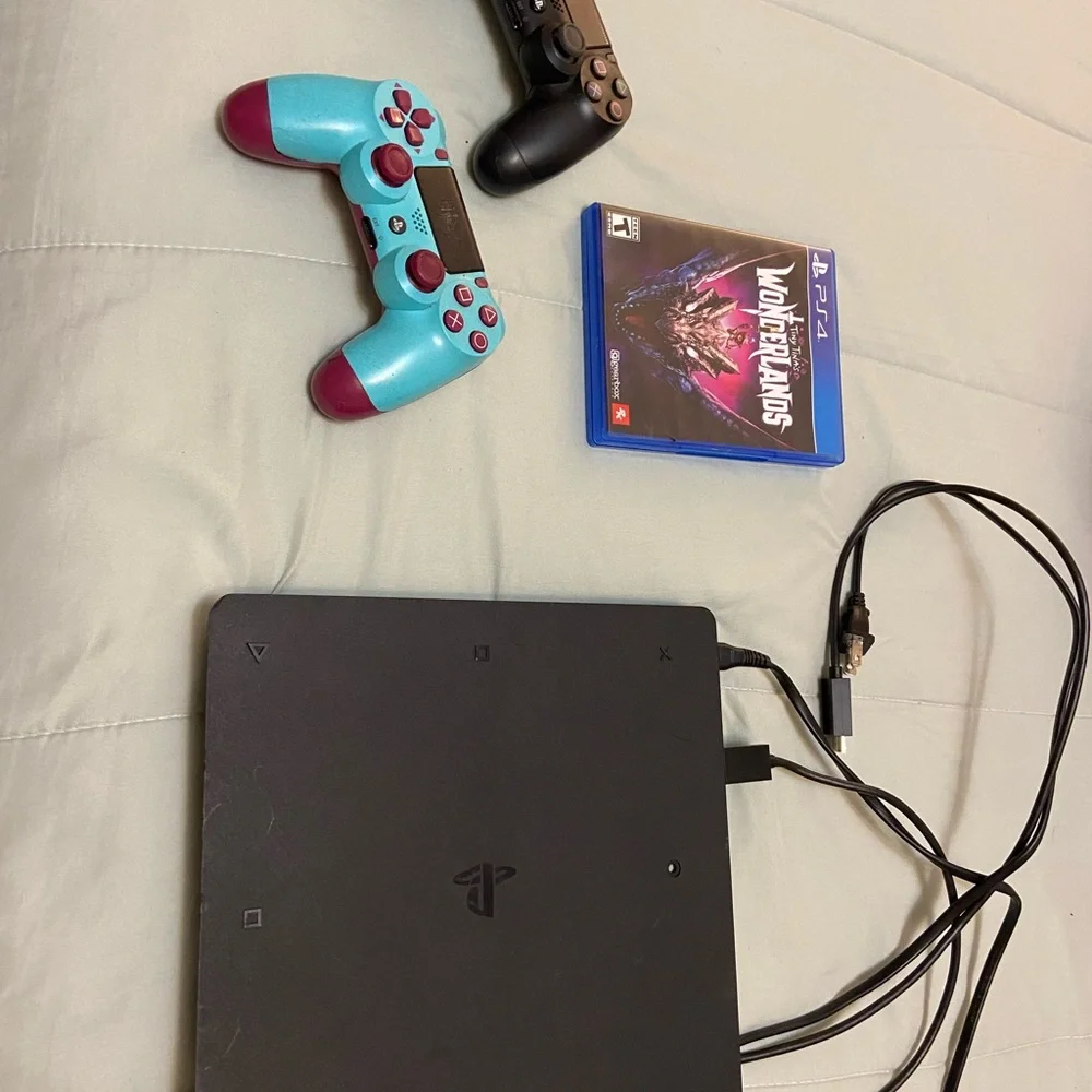 Sony PlayStation 4 Console with Black and Teal Controllers